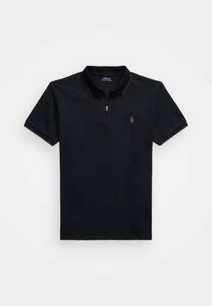 Polo de marinha feito de algodão, com gola de zip, mangas curtas, costura contrastante e um pequeno logótipo bordado no peito.