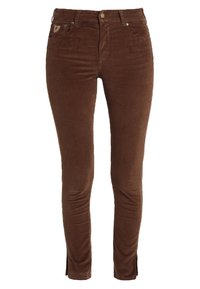 Bruna kordflöjtskyddande skinnybyxor med en slät textur, femfickorsdesign, knappstängning fram och med slitsar vid anklarna för extra detalj.