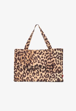 Leopard print tote bag featuring a large "HARPER" design in black, made from fabric with reinforced handles for durability.