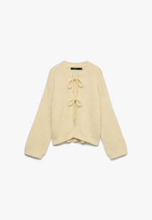 Strickjacke in Cremefarbe mit langen Ärmeln und zwei vorderen Bändern, mit leicht verkürztem Schnitt und rundem Ausschnitt.