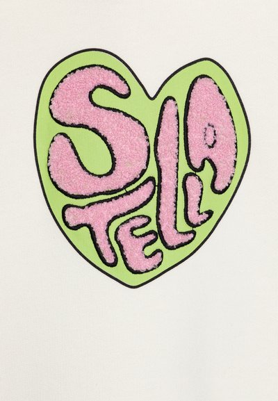 White fabric features an embroidered heart design in green with pink, fluffy lettering spelling "Stella." Black outlining accentuates the shape.