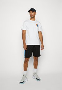 Puma SHOT BLOCKER SHORT - Spordišortsid - black/racing blue