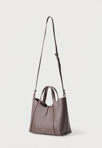 Brown leather handbag with a structured design, two top handles, and an adjustable shoulder strap. Features gold-tone hardware accents.