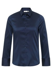 Camicia blu navy con bottoni in tessuto liscio, caratterizzata da colletto, maniche lunghe e chiusura a bottoni sul davanti. I polsini presentano una leggera lucentezza.