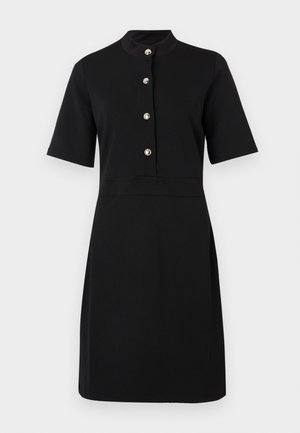 Black dress made of smooth fabric, featuring short sleeves, a high collar, and five gold-tone buttons down the front. A-line shape.