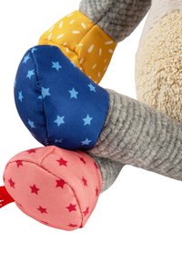 Stuffed toy with multicolored limbs. Gray textured body, blue limb with star pattern, pink limb with red stars, yellow fabric accent.