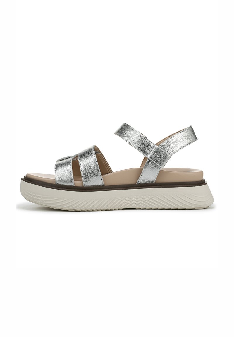 Silver metallic sandals with two crossed straps, a padded beige footbed, and a textured white platform sole.