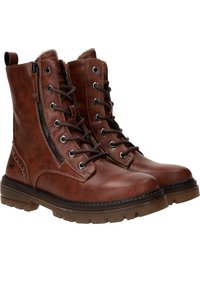 Bottes en cuir marron avec un laçage à l'avant, fermeture éclair sur le côté et semelle en caoutchouc épaisse. Caractéristiques : œillets en métal argenté et accents de coutures décoratives.