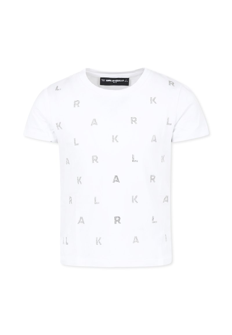 T-shirt en coton blanc à manches courtes, arborant un imprimé répétitif de lettres métalliques dans un motif dispersé sur le devant.