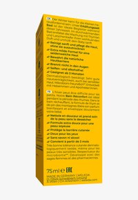 Confezione gialla brillante con testo in tedesco e francese. Contiene dettagli sul prodotto e istruzioni per l'uso. Volume: 75 ml. Prodotto in Germania.
