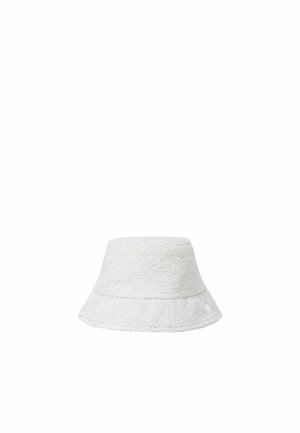 Chapeau bob blanc texturé à large bord évasé, présenté sur un fond blanc uni.