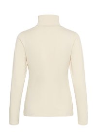 Chemise à col roulé couleur crème à manches longues vue de dos sur un fond blanc uni.