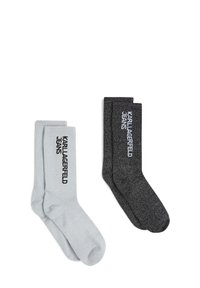 Dve pare rebrastih nogavic: ena svetlo siva in ena temno siva, s potiskom "KARL LAGERFELD JEANS" v črni barvi na vsaki.