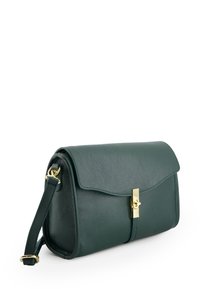 Green leather handbag with a textured finish, gold hardware, and a flap closure. Includes a detachable strap for versatility.