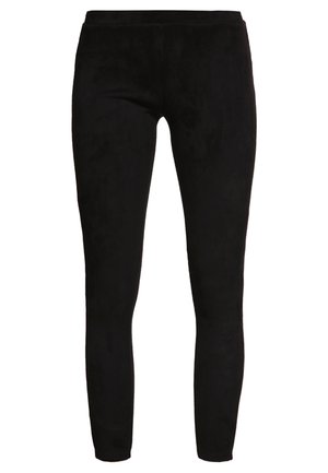 Čierne legíny vyrobené z mäkkého, textúrovaného materiálu s priliehavým strihom, s hladkým pásom a bez ďalších akcentov alebo vzorov.