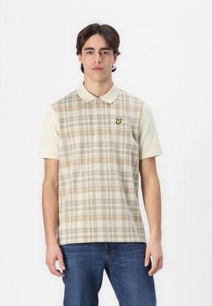 Kortærmet polo skjorte med et beige og ternet mønster, der har orange og grå linjer, samt et lille gult logo på brystet.