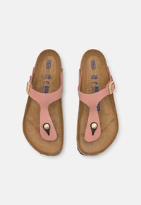 Pink slip-on sandals with a thong design, featuring a gold buckle, black accent, and a contoured brown footbed. Size 38 indicated.
