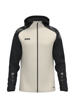 Chaqueta con capucha y cremallera, frontal beige, mangas negras, hombros estampados y logo JAKO en el pecho izquierdo.