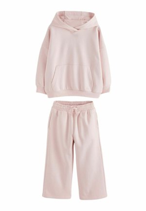 Sweat à capuche oversize rose clair avec poche kangourou et pantalon large assorti à taille élastique avec cordon.
