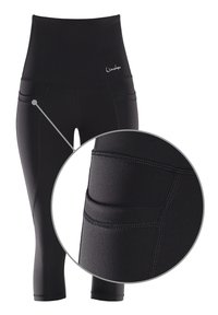 High-waisted black leggings made of stretchy fabric with a seamless design, featuring side pockets and reinforced stitching.