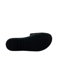 Suola di scarpa in gomma nera con motivo di presa testurizzato, caratterizzata da una leggera curvatura all'altezza delle dita e una sezione del tallone ben definita.