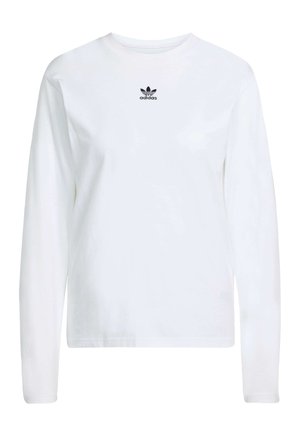 Hvid langærmet t-shirt lavet af bomuld, med en rund halsudskæring og et lille sort Adidas-logo på brystet. Simpelt, klassisk design.
