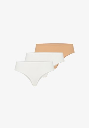 Kolmet saumattomat naisten alushousut beige- ja valkoisissa väreissä, järjestetty kerroksittain eteenpäin suuntautuvana rivinä.