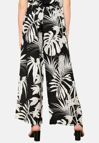 LolaLiza WIDE WITH TROPICAL PRINT - Pantaloni - black