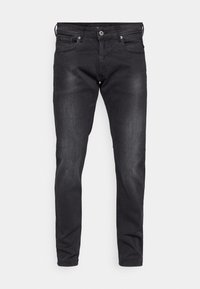 Čierne riflové džínsy so slim fit strihom, štýlom s piatimi vreckami a zapínaním na gombík. S jemným zosvetlením a hladkou textúrou.