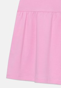 Pink cotton dress featuring a fitted bodice and a flared skirt, with gathered detailing at the waist and a smooth texture.