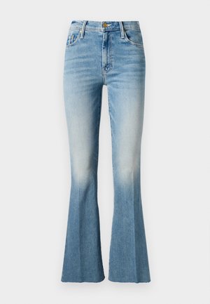 Blue denim flared jeans with a high waist, featuring a faded wash and contrasting stitching. Gold-tone hardware on the button closure.