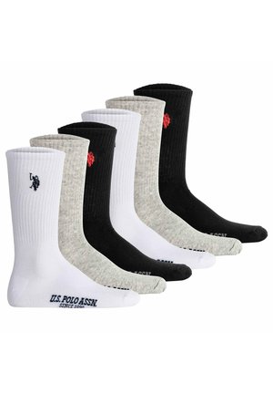 Set di sei calzini lunghi fino alla caviglia in nero, bianco e grigio. Presentano una texture a costine con dettagli del logo nella parte superiore e nella punta.