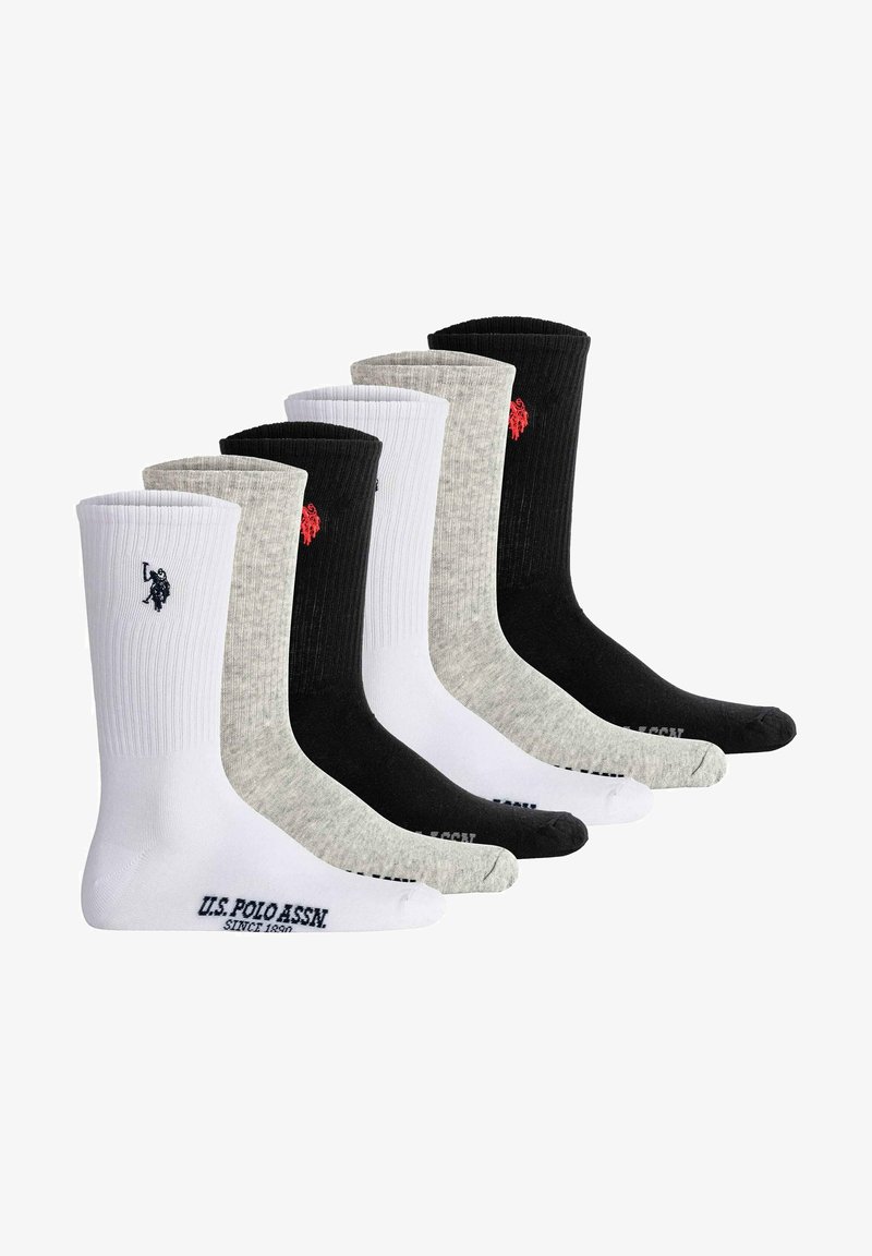Sæt med seks ankelsokker i sort, hvid og grå. Har ribbet tekstur med logo accenter ved toppen og tåområdet.