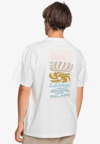 White cotton t-shirt with a colorful graphic print on the back featuring abstract wave and mountain designs in pastel colors.