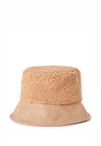 Klobouk typu bucket s texturovanou, chlupatou horní částí světle béžové barvy a hladkým, plstěným okrajem. Zaoblený tvar s měkkým textilním povrchem.