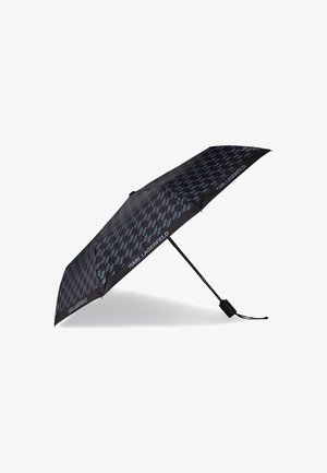 Parapluie noir avec un motif à logo 'K' bleu répété, doté d'un manche droit et d'une poignée noire. Design compact pour un transport facile.