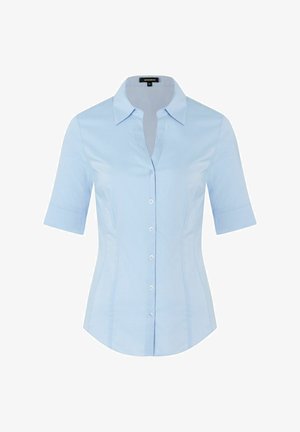 Light blue short-sleeve shirt with a pointed collar, button front, and fitted silhouette. Made of smooth fabric, featuring subtle side seams.
