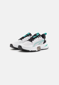 White athletic shoes with a black collar, turquoise accents, and mesh upper. Features a cushioned sole and a textured outsole.