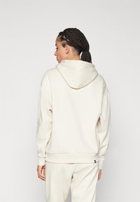 Puma ANIMAL HOODIE  - Jersey con capucha - alpine snow