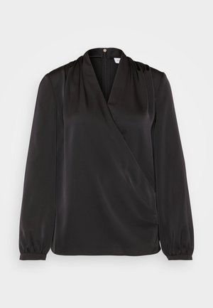 Blusa negra de manga larga con diseño cruzado, hecha de tela suave. Presenta detalles fruncidos en los hombros y puños elásticos.