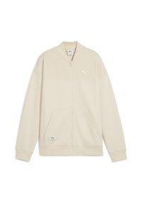 Beige fuld-zip Puma-jakke med struktureret stof, ribbet krave, manchetter, to forlommer og Puma-logo på brystet og lommen.