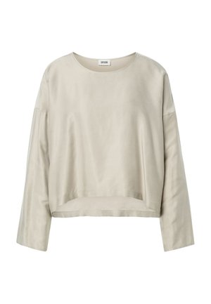 Top beige a maniche lunghe con scollo tondo, leggermente corto e dalla vestibilità ampia con spalle scese, realizzato in tessuto liscio.