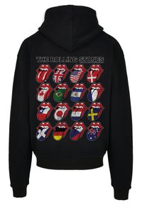 Black hoodie featuring a collage of 16 iconic lips designs, each adorned with various national flags, text "THE ROLLING STONES" in white.