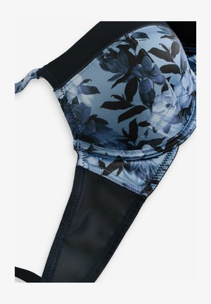 Floral print bra featuring a blue background with dark leaves and light flowers, underwire support, black lace sides, and adjustable straps.