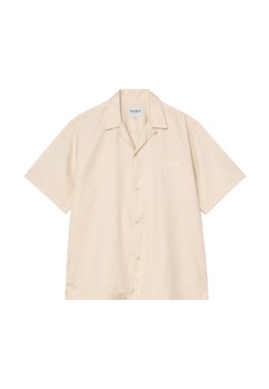 Camisa beige de manga corta con botones, cuello abierto y pequeño logo bordado en blanco "Carhartt" en el pecho izquierdo.