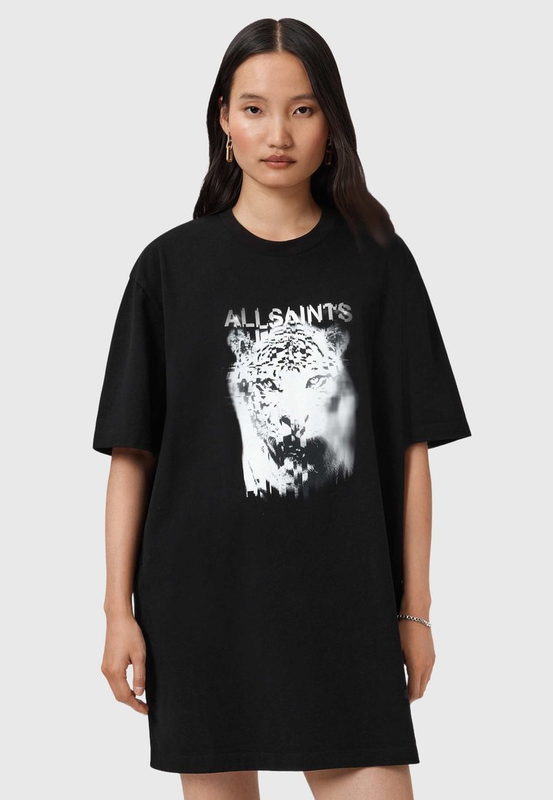 Camiseta negra de gran tamaño hecha de algodón, con un gráfico de un leopardo blanco y el texto "ALLSAINT'S" en un estilo desgastado.