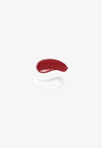Two swatches of cosmetic cream on white background, one deep red and one translucent white with small bubbles.