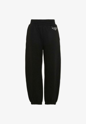 Pantalon de survêtement noir à taille élastique avec poignets froncés et petit logo blanc Givenchy sur la partie supérieure de la cuisse gauche.