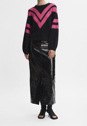 Black sweater with pink chevron and stripes paired with a black croc-texture midi skirt and open-toe black heeled boots.