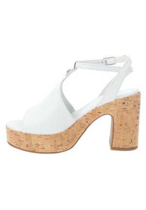 White open-toe platform sandals with a cork-wrapped block heel and adjustable ankle strap. Smooth upper material and flat inner sole.